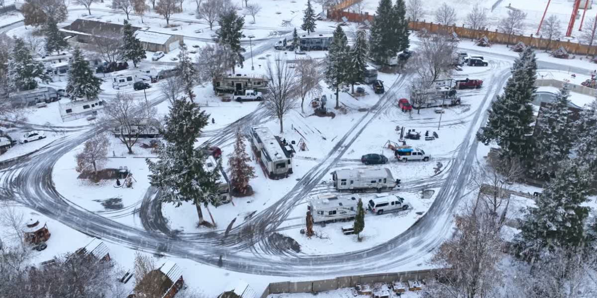 an RV park in the winter full of campers wondering "how much snow can a camper roof hold?"