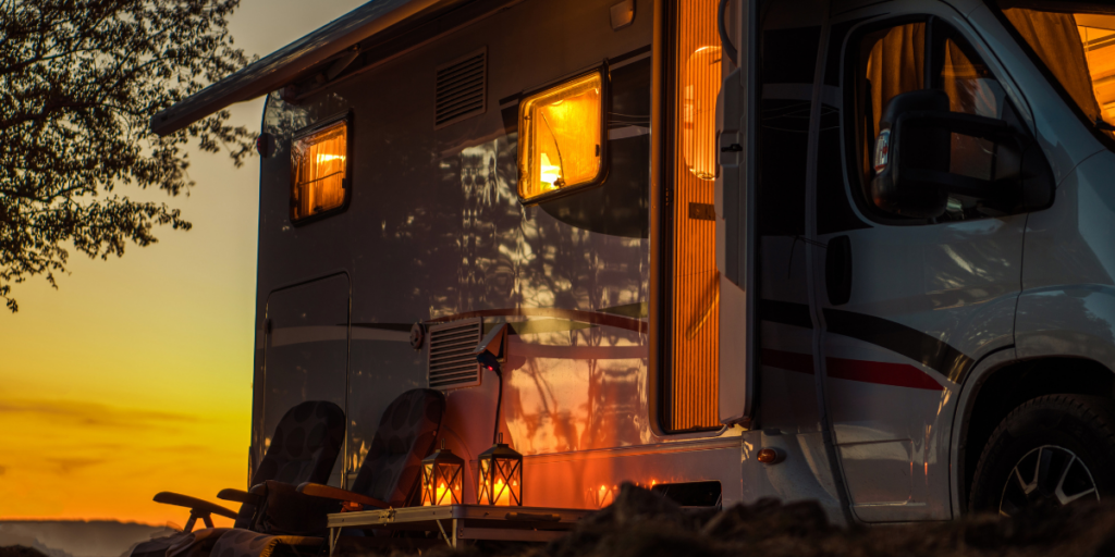 a RV, at sunset, belonging to someone who's wondering if RV insurance covers delamination.